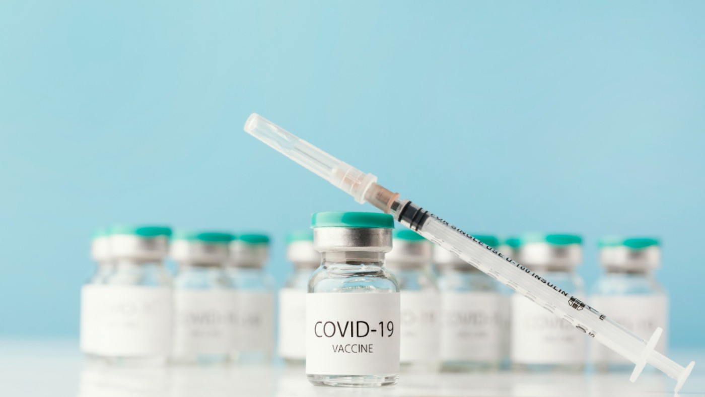 Covid Vaccine arrangement-with-coronavirus-vaccine-bottle (1)
