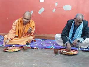 Yogi has 'khichdi' at Dalit party worker's home