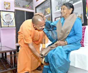 Yogi Adityanath meets mother, touches her feet