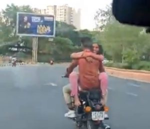 Man Woman Romancing on Motorcycle (1)