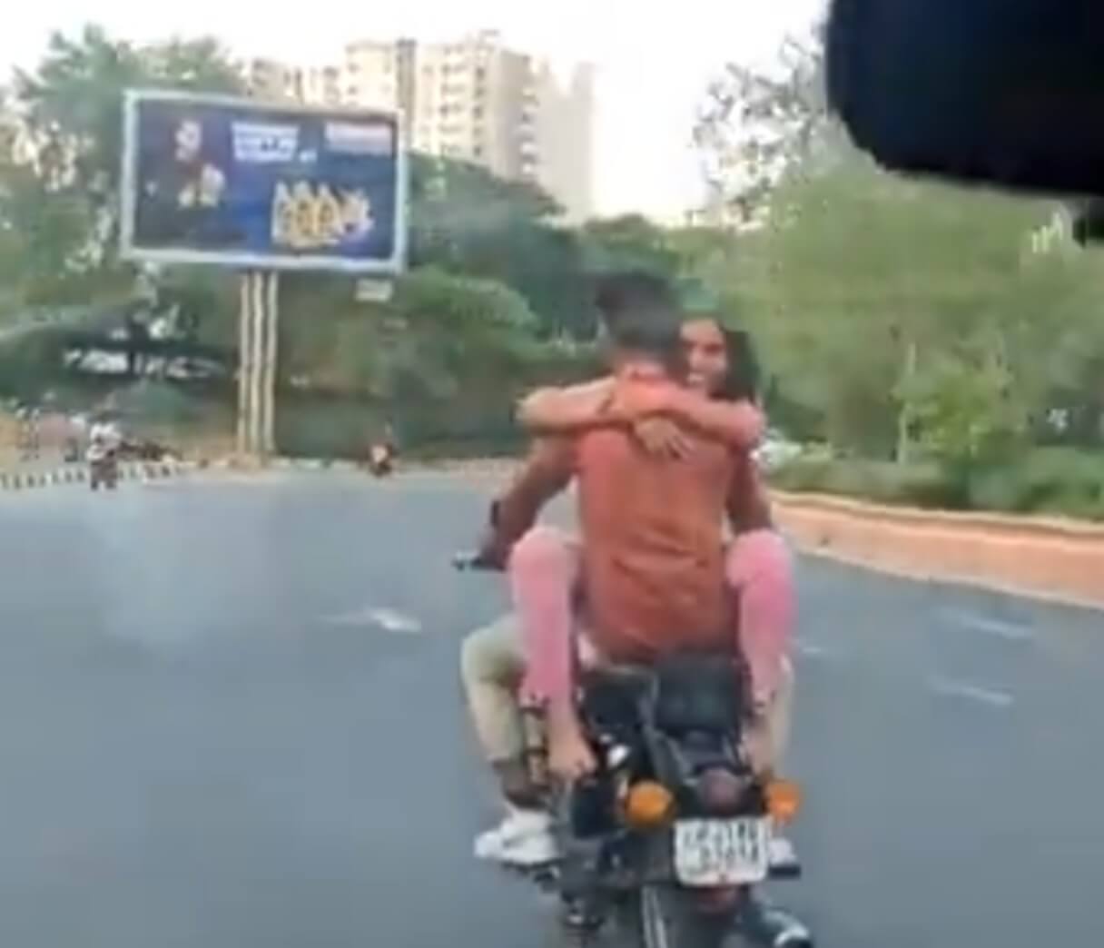 Man Woman Romancing on Motorcycle (1)