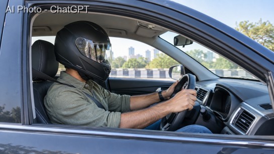 MEN WITH HELMET IN CAR